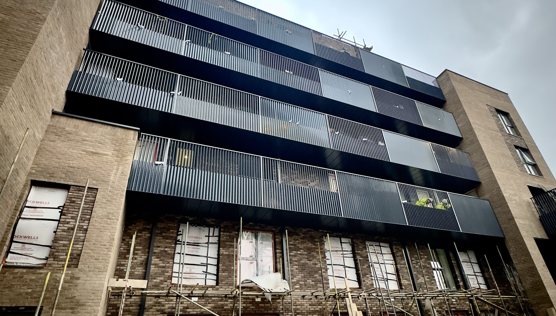 Aluminium balcony soffits and balustrades at Cherry Garden School in Bermondsey, London
